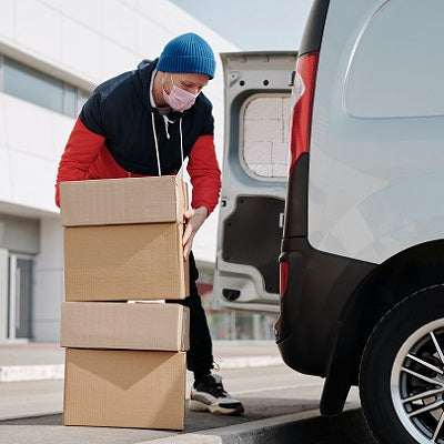Person packing boxes into a car.jpg
