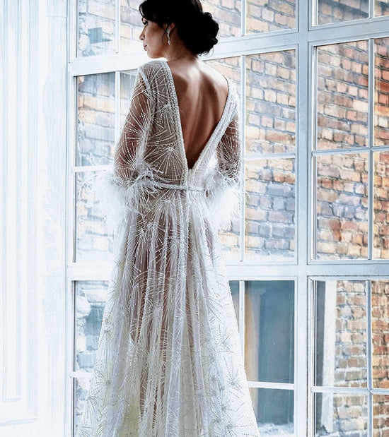 Woman in white lacy feathery wedding dress