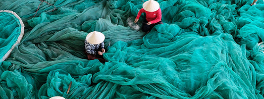 Several people standing in a sea of Polyester fiber