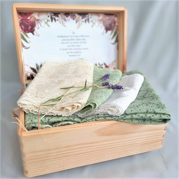 Wooden box with green folded laces and lavender flowers