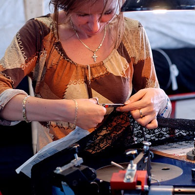 Person cutting a CHANTY lace to designated size.jpg
